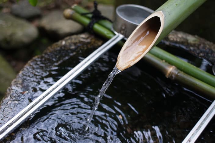 Shishi-odoshi or bamboo water pipe in Japanese garden